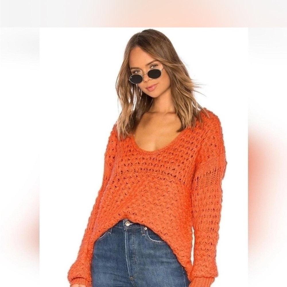Free People Crashing Waves pullover sweater in an orange crochet knit